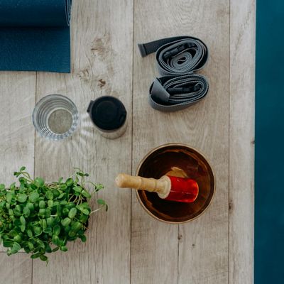 Yoga blocks and strap on a wooden floor